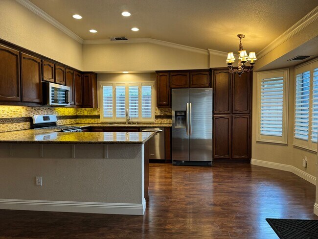 Building Photo - Immaculate home with pool & hardwood floors!