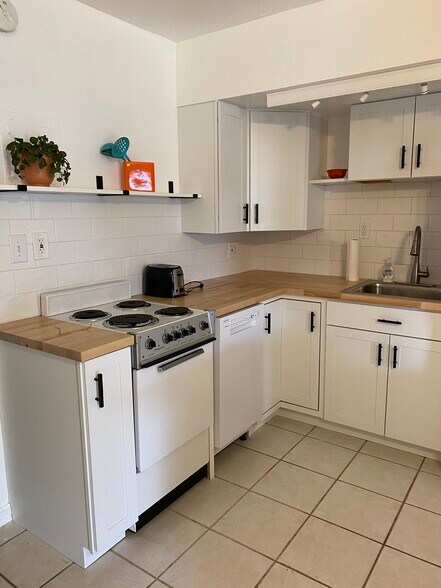 Butcher block countertops, lazy susan storage - 300 Monroe Ave