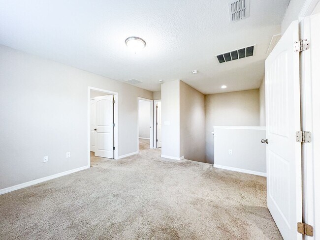 Building Photo - Spacious 4-Bedroom Townhome in Harmony – A Perfect Blend of Nature & Comfort!