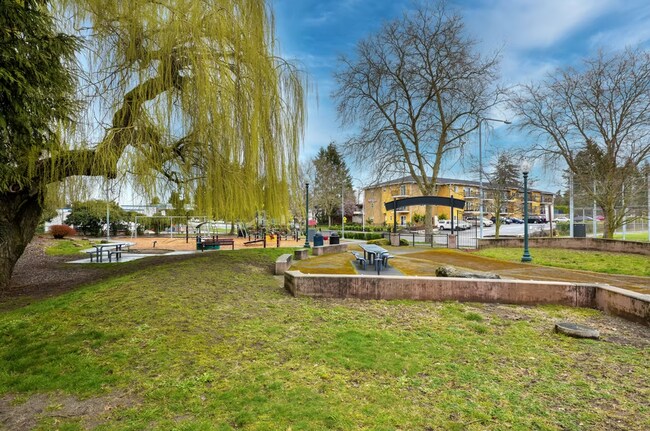 Building Photo - Spacious Two-Bedroom, Two-Bath Living at Marigold Apartments — Available Now