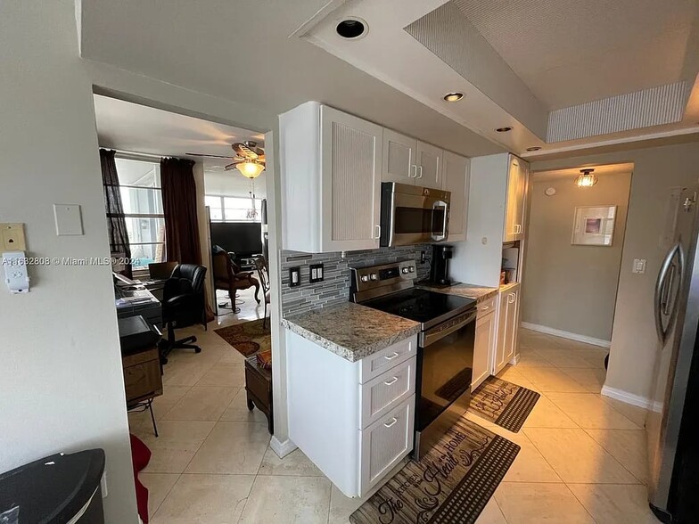 Kitchen to dining area - 18081 Biscayne Blvd