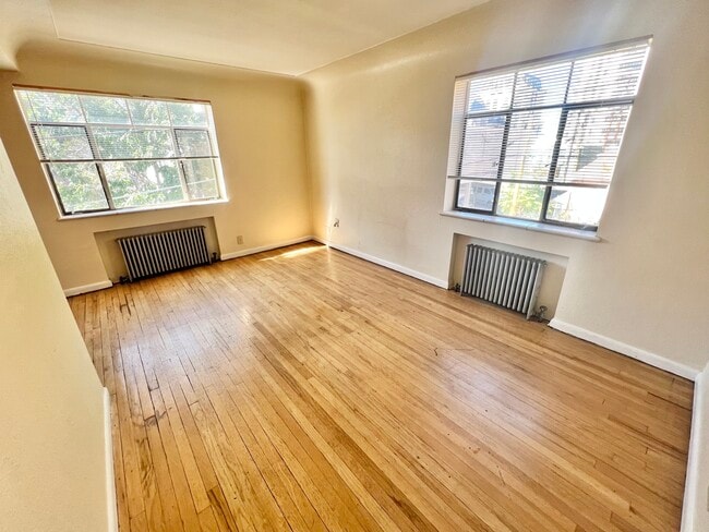 Experience the charm of abundant natural light in this inviting space, perfect for relaxation. - Hillside Apartments