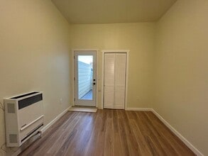 Building Photo - Comfortable room, has communal kitchenette, and bathrooms