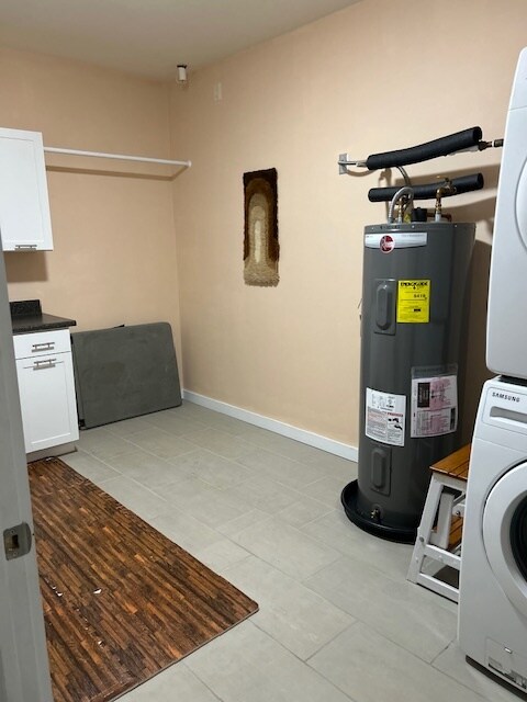 utility room with storage, washer and dryer - 400 N Richmond St