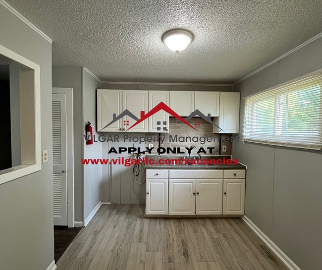 Building Photo - Step into comfort and security in this bea...