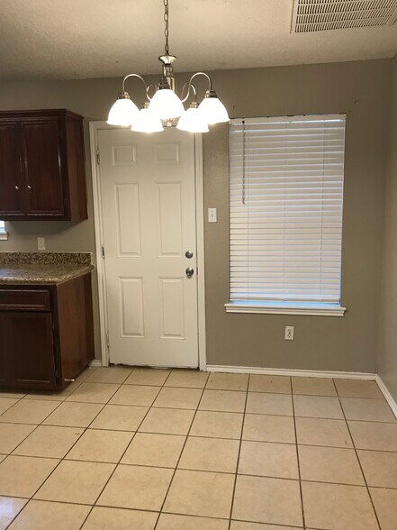 Dining area next to kitchen. - 1801 Lexington Circle