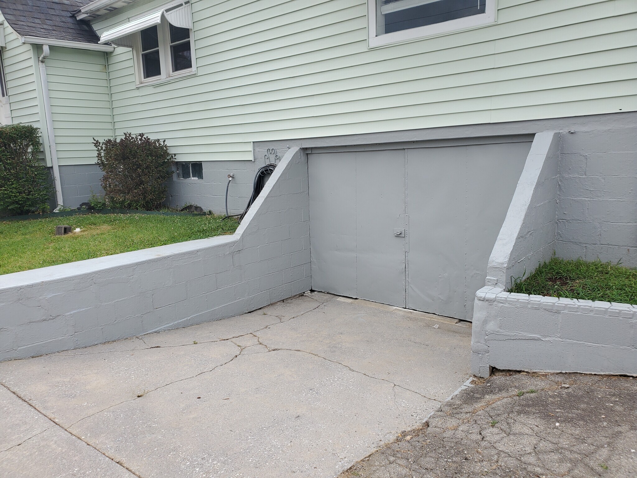 Double doors go under house - 358 E Lincoln Rd