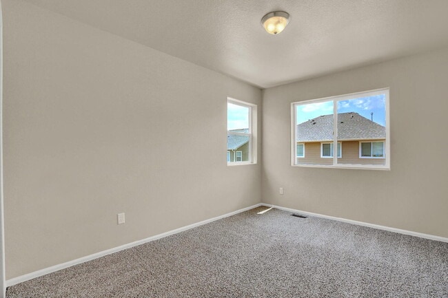 Building Photo - Modern Townhome with Central A/C, 2-Car Ga...