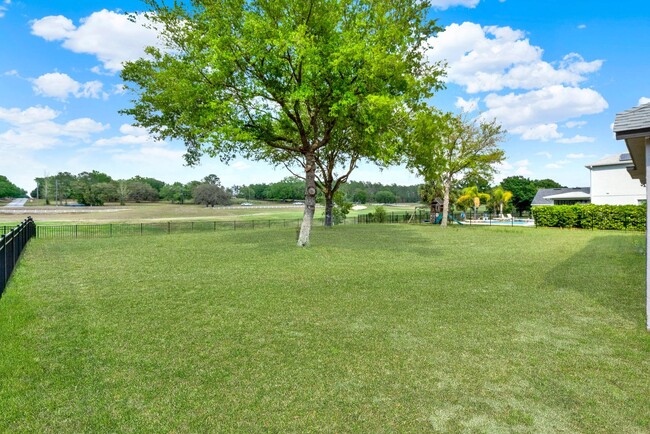 Building Photo - RENOVATED 5 BEDROOM FENCED IN, GOLF FRONTA...