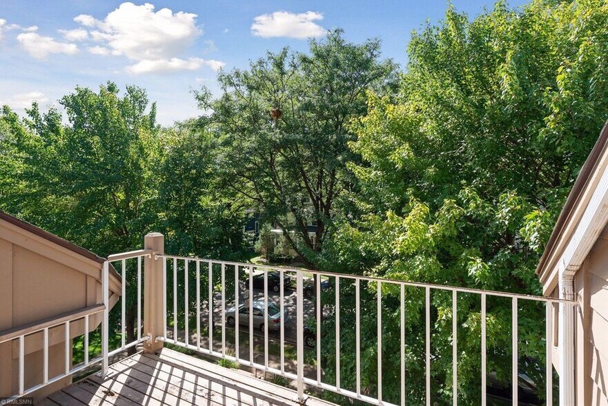 Private outdoor balcony overlooking tree-lined street - 2838 Kenwood Isles Dr