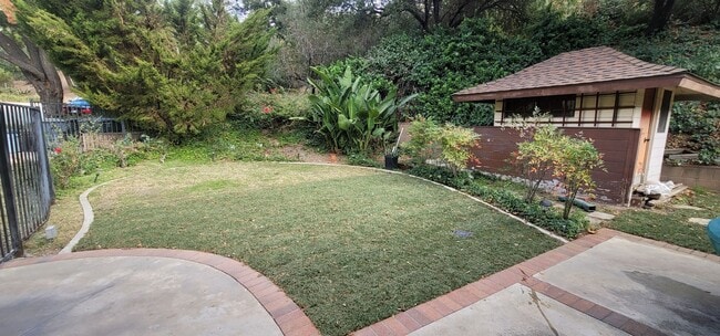 Building Photo - Classic, Midcentury 3 bedroom with Den, 2.5 bath home nestled into hillside with secluded backyar...