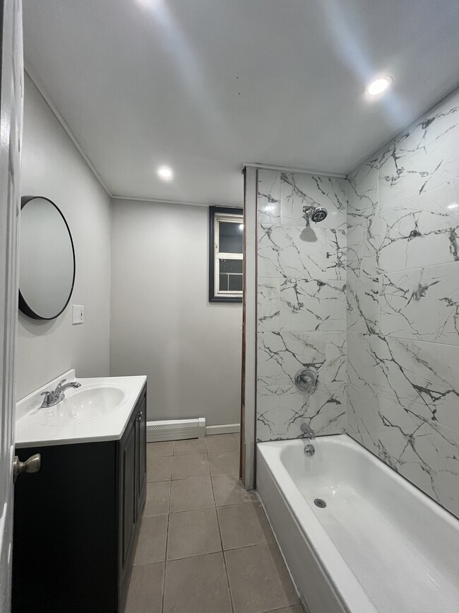 Upgraded bathroom - new tiles, toilet and cabinet - 125 S 9th St