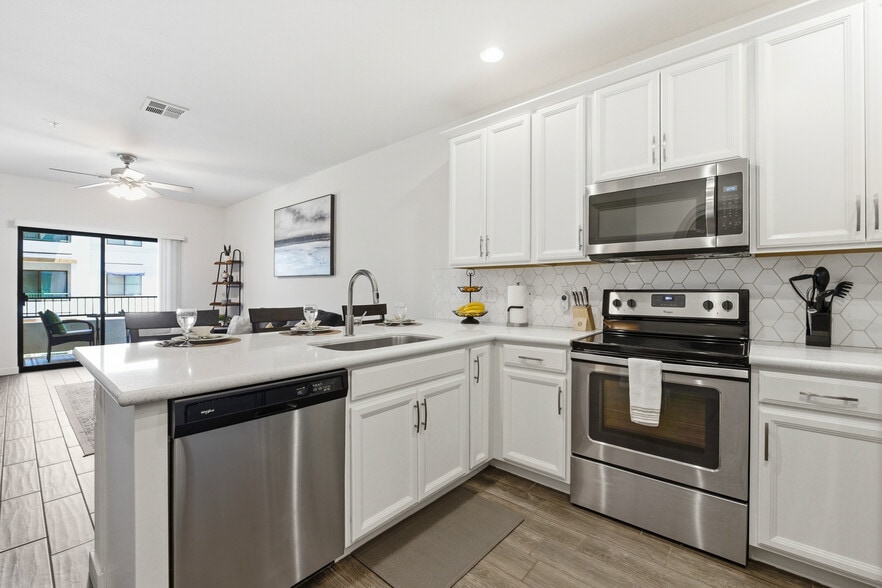 Spacious kitchen featuring premium finishes and everything you need. - 2511 W Queen Creek Rd