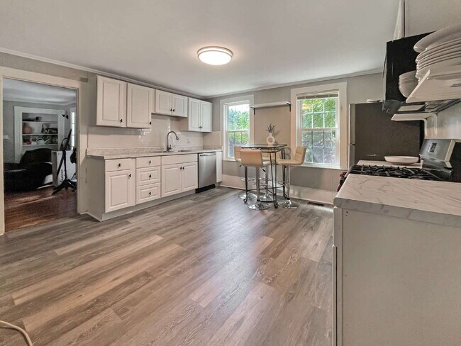 Building Photo - Seeking a roommate for a 2 bdr, 2 bath lower level condo with a porch and private yard, 1.5 miles...