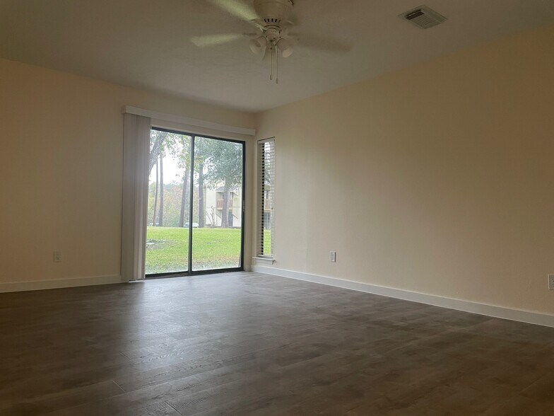 Master Bedroom overlooks shared grass center court - 15919 Golf Club Dr