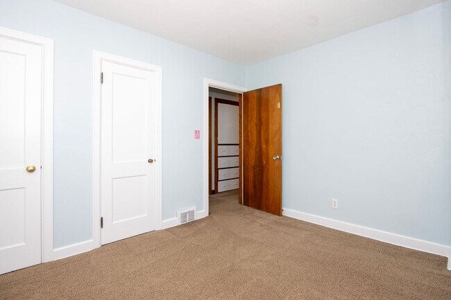 Building Photo - Four Bedroom Single-Family Home