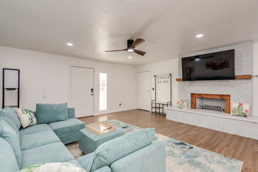 Spacious Livingroom with 65' TV - 9870 E Celeste Dr