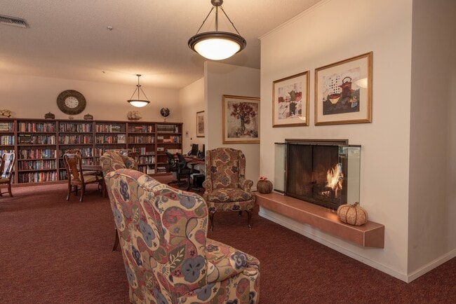 Library and fireplace in the Common Area - Roseville Commons Senior Living