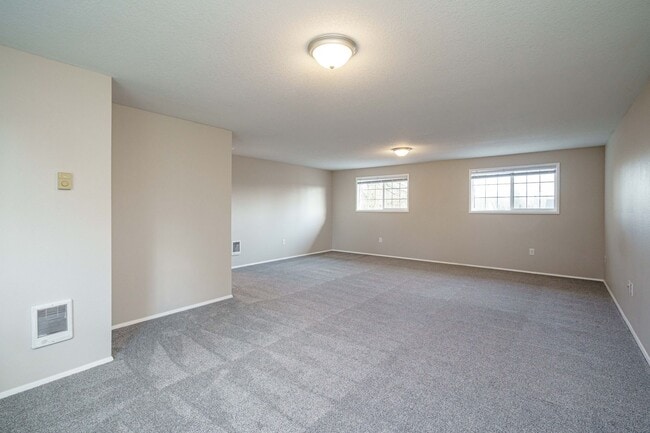 Building Photo - Recently Updated with Wood Laminate Flooring and Fresh Paint
