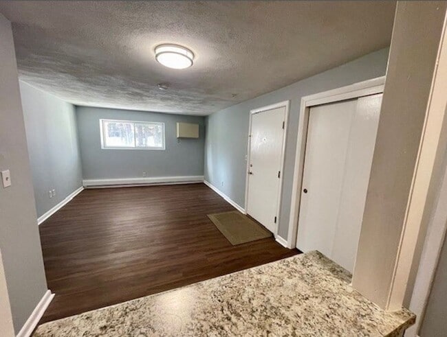 Building Photo - Fresh 1 Bedroom Corner Condo with 2 Off Street Parking Spaces