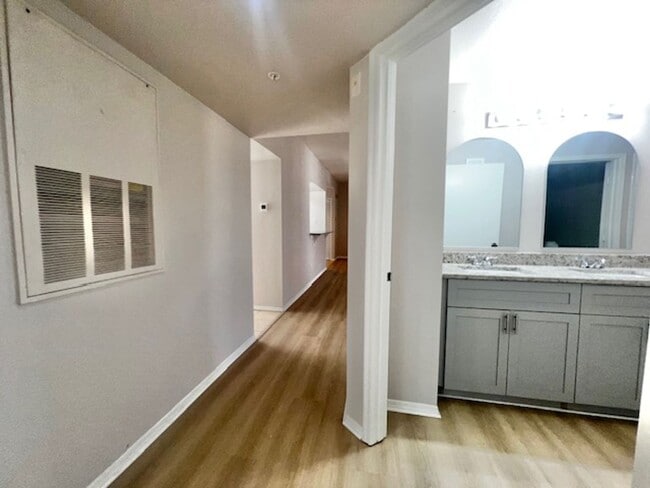 Building Photo - NEW-Remodeled bathroom & kitchen! NEW VINYL PLANK flooring & fresh paint! 2 bedroom 1 bath condo ...