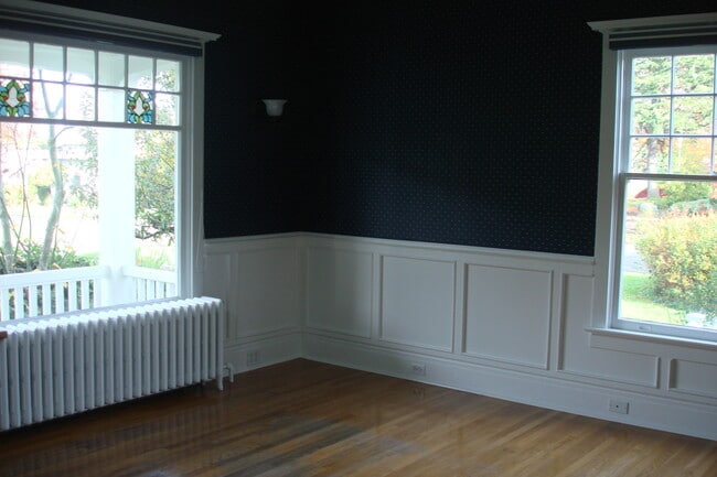 Living Room, Wallpaper + Wainscotting, radiators warm with radiant heat - 3402 N 28th St