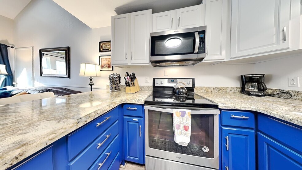 full kitchen with granite counters, stainless steel appliances - 1530 Empire Ave