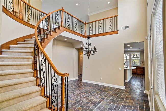 Building Photo - "Spacious 4-Bedroom Retreat with Cozy Fire...