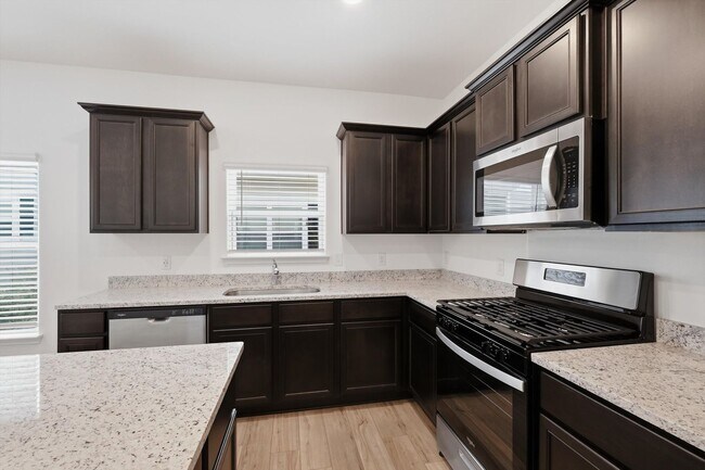 Building Photo - Clean & Modern Townhome with No Carpet and Lawn Service Included