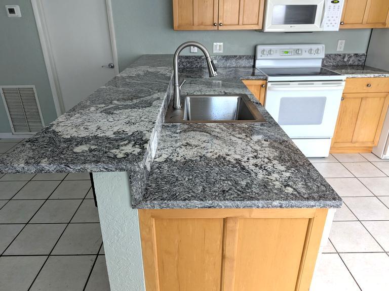Kitchen granite countertop & wet bar - 1225 SW 4th Ct