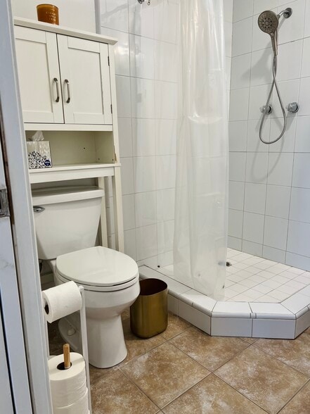 Bathroom toilet and storage shelf - 1404 N Buena Vista St