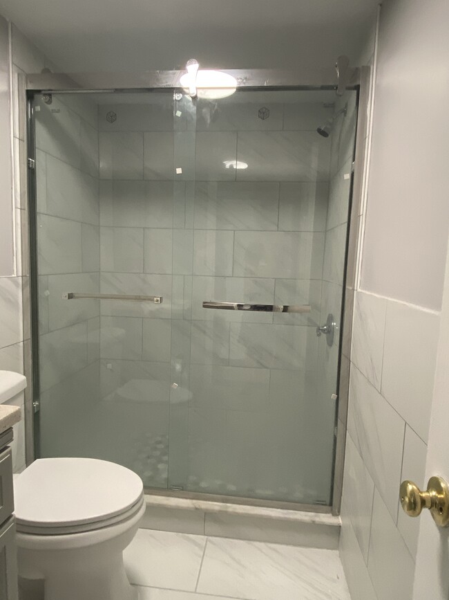 2nd Modern spacious full bath, large shower, porcelain tile floor, granite countertop - 1618 Fitzwater St