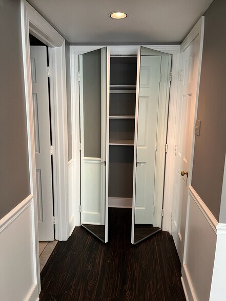 Bath left, linen ahead, walk-in right - 2 River Rd