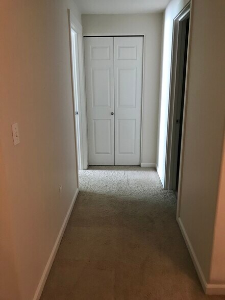 Hallway with coat closet - 730 NW 185th Ave