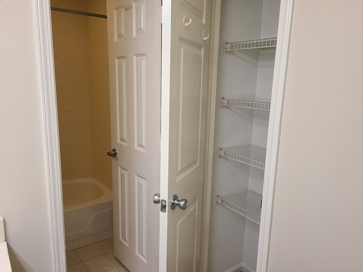 Master bath linen closet - 12439 Coursey Blvd