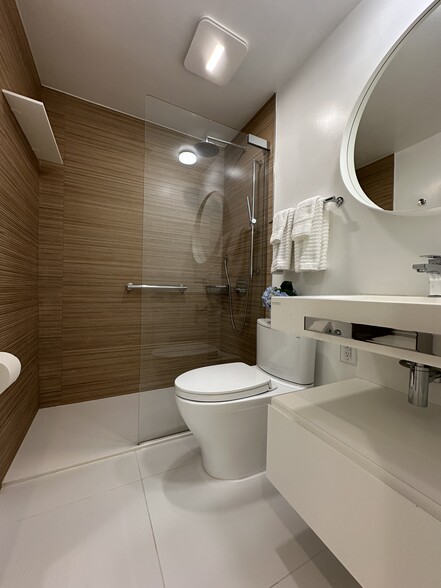 Newly renovated bathroom featuring Porcelanosa fixtures , tile, sink - 3042 R St NW