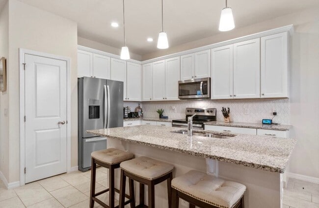 Building Photo - Water Front Home- 4 Large Bedrooms-3 baths Gated Community Call Sheila Campbell 407-687-7900