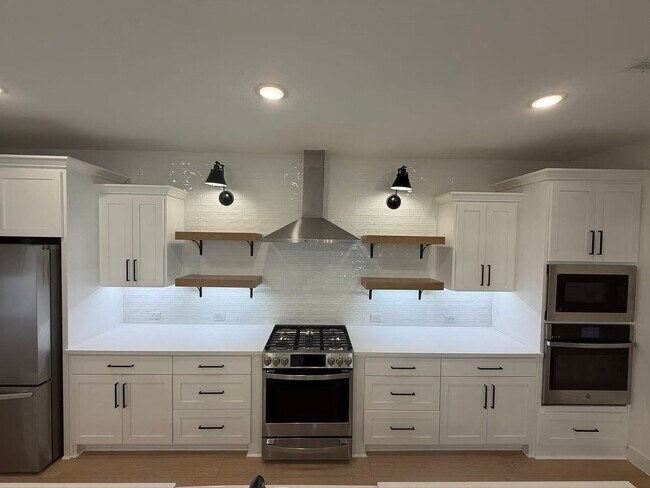 Building Photo - Move-in ready and like-new! Washer, dryer, and refrigerator Included.