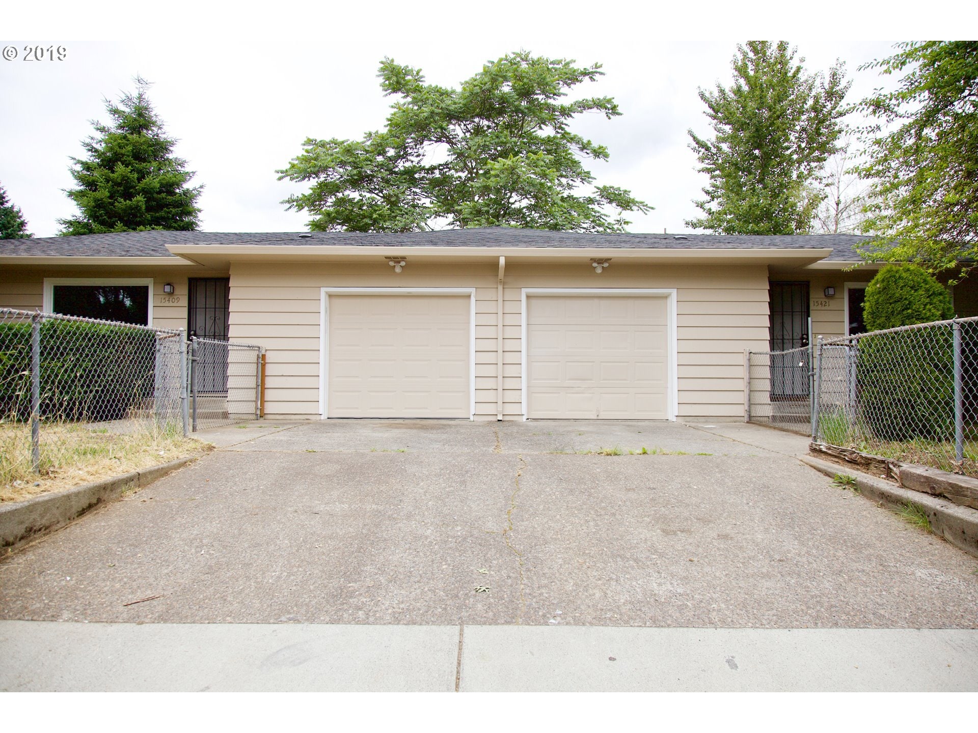 Driveway and garage. - 15421 SE Stark Street