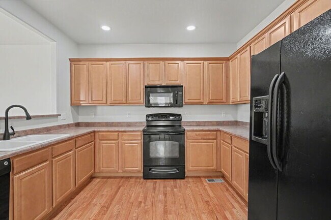 Building Photo - Beautifully Updated 3-Bedroom End-Unit Townhome Facing Open Space with Attached 2-Car Garage in G...