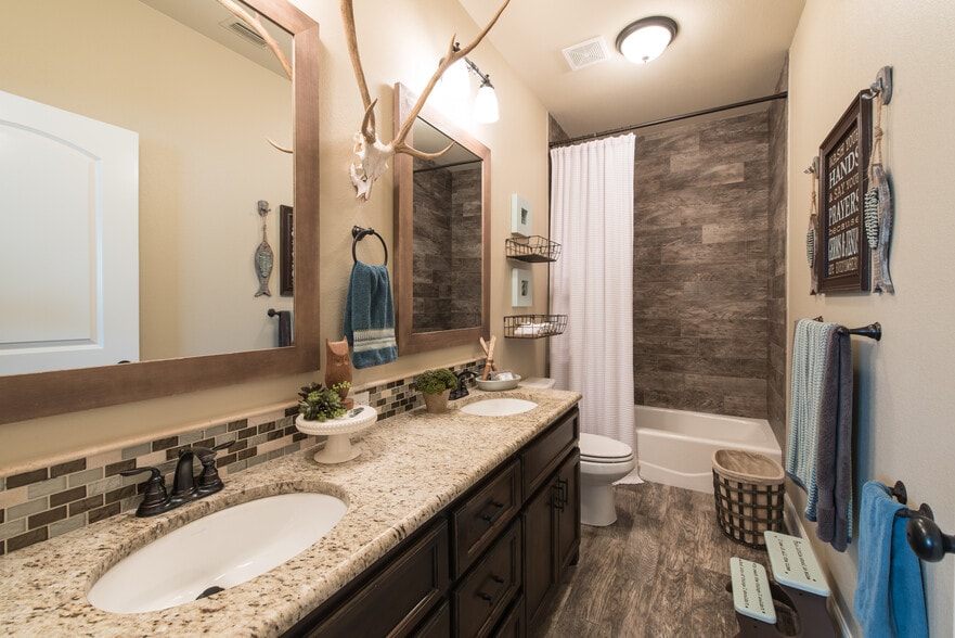 Wood-look tile on floor and shower surround create a cohesive feel and low maintenance cleaning! - 249 Springfield