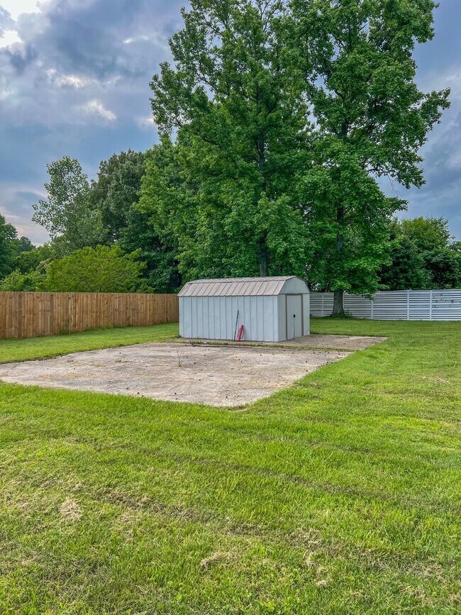 Building Photo - Massive Fenced Backyard with a Shed and Ga...
