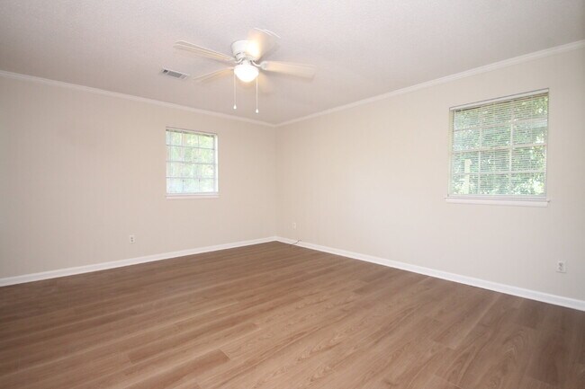 Building Photo - Fully Renovated 3BR/2BA Molino Home on a Spacious Lot Featuring Multiple Living Areas, Sunroom & ...