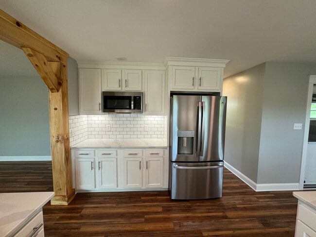 Building Photo - Exquisite Brick Ranch with Modern Upgrades, Countryside Charm And Two Car Garage