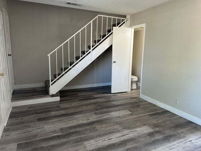 Building Photo - Three bedroom townhome with 2 car garage a...