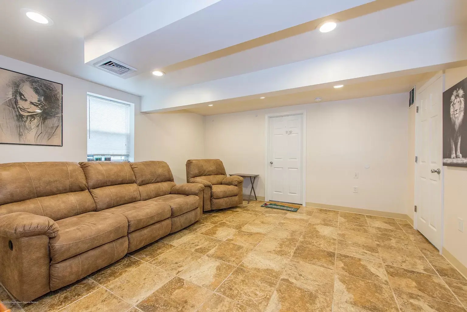 Pictures have removed and there is a new sectional couch - 118 6th Ave