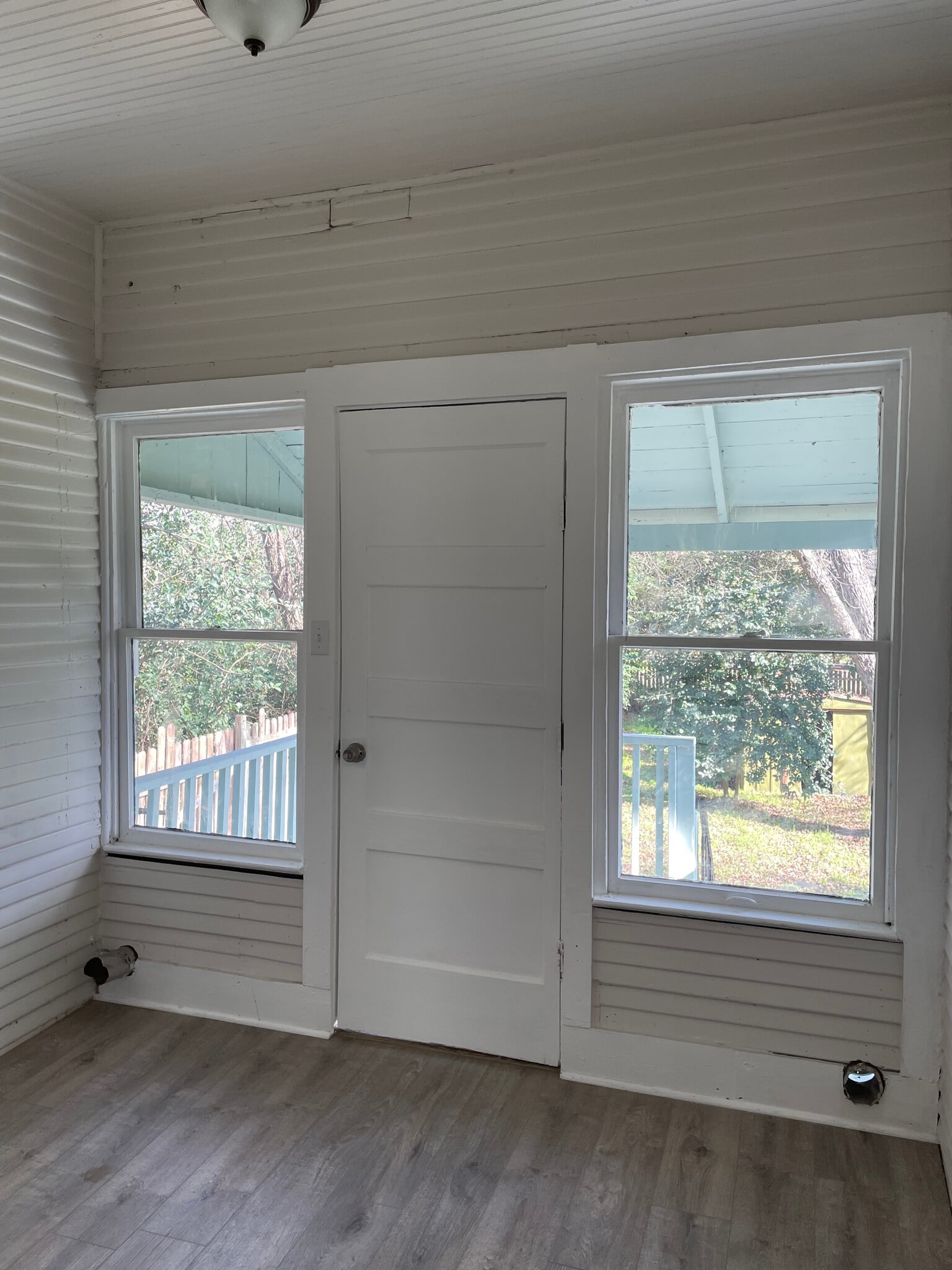 Utility room opening to covered back porch - 810 Aganier Ave