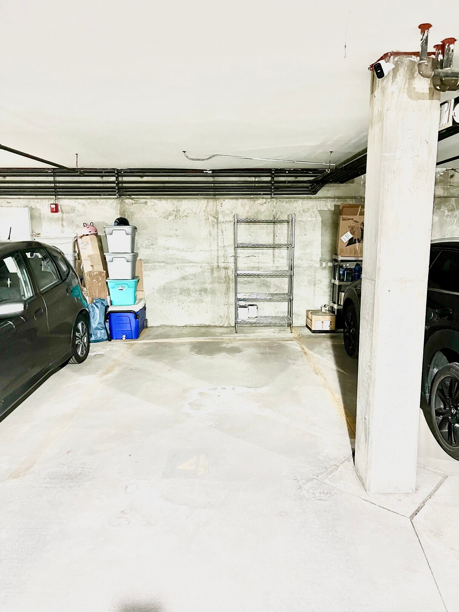 Assigned garage parking space with storage area/shelving - 2422 Tremont Pl