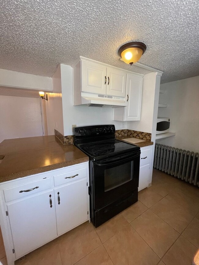 Building Photo - Studio Apartment - All basic utilities inc...