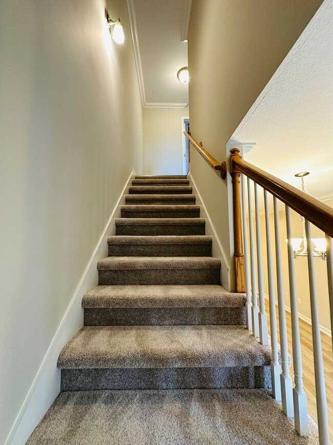 Building Photo - 2 bed, 2.5 bath updated townhouse w/ 1-car garage & Trex deck available now